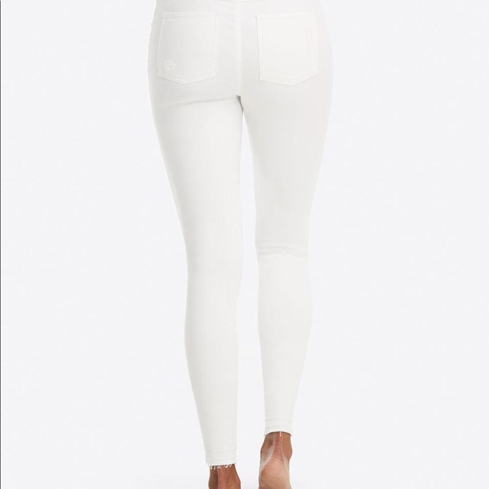White ripped spanx jeans